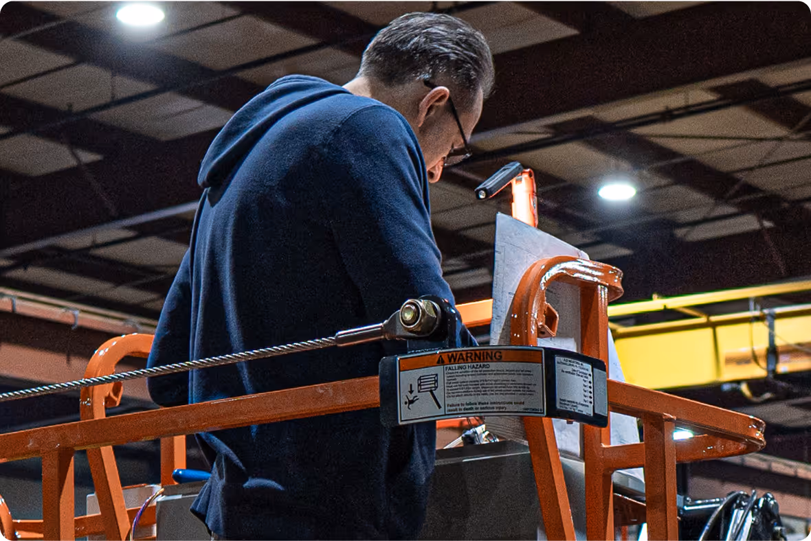 Bailey technician assembling an aerial lift on the manufacturing floor