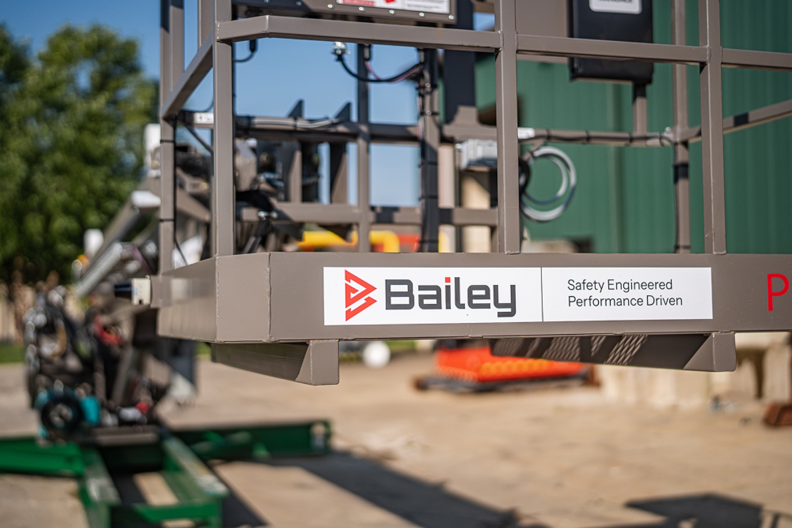 Bailey clean room lift in use — operator in cleanroom PPE with semiconductor equipment visible