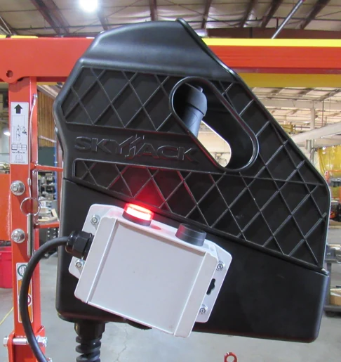 Platform-side CAS user interface with override button, stop-zone LED, and warning buzzer mounted next to the operator controls