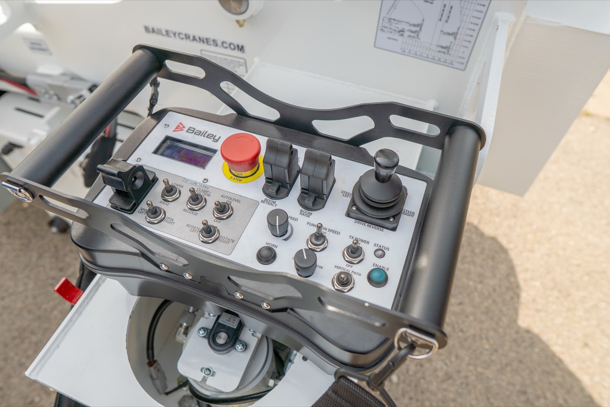 Close-up of the Bailey CH 6 OMNI wireless control panel used for precise, low-speed equipment placement