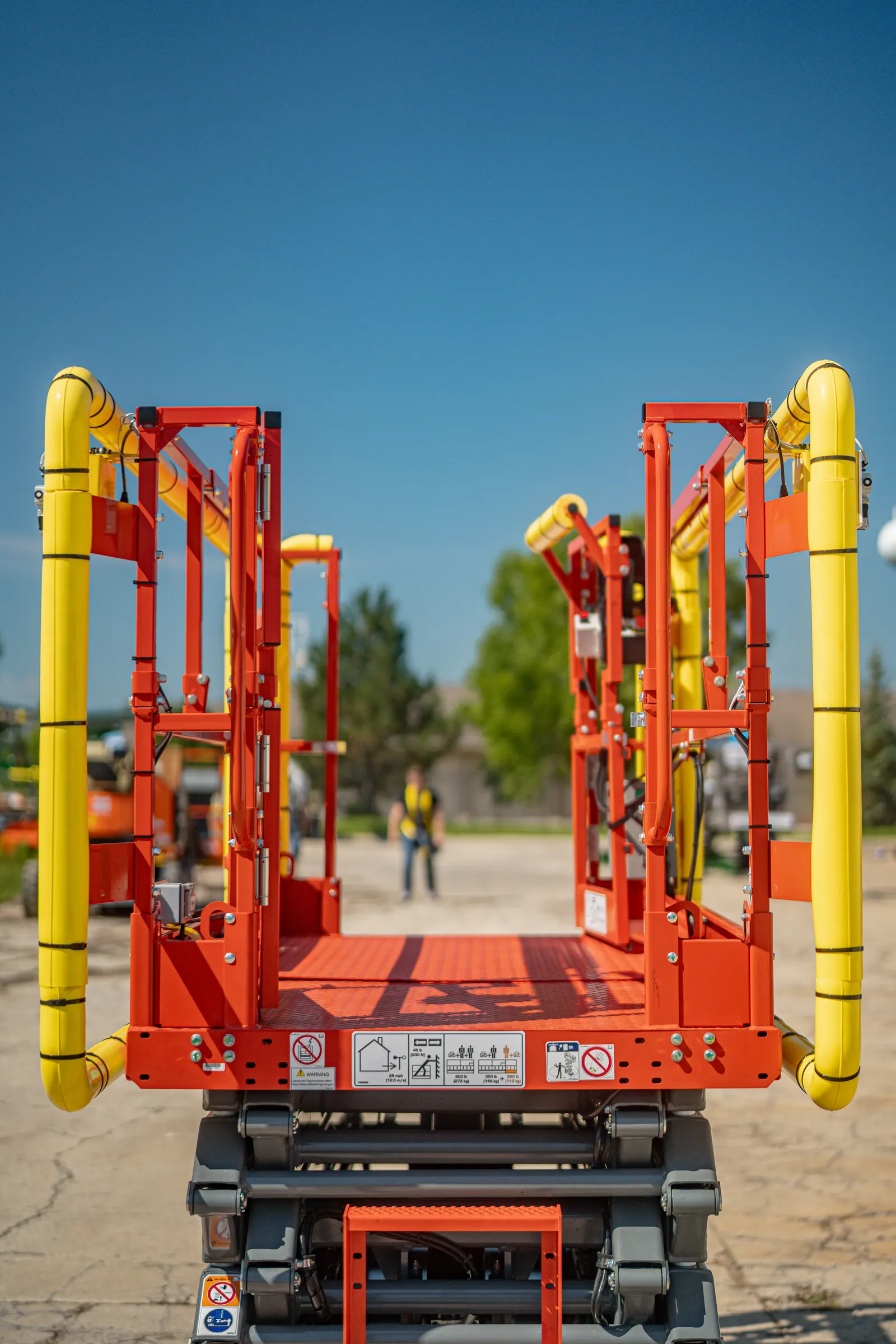 Operator using a crane with retrofitted collision avoidance providing live zone status feedback