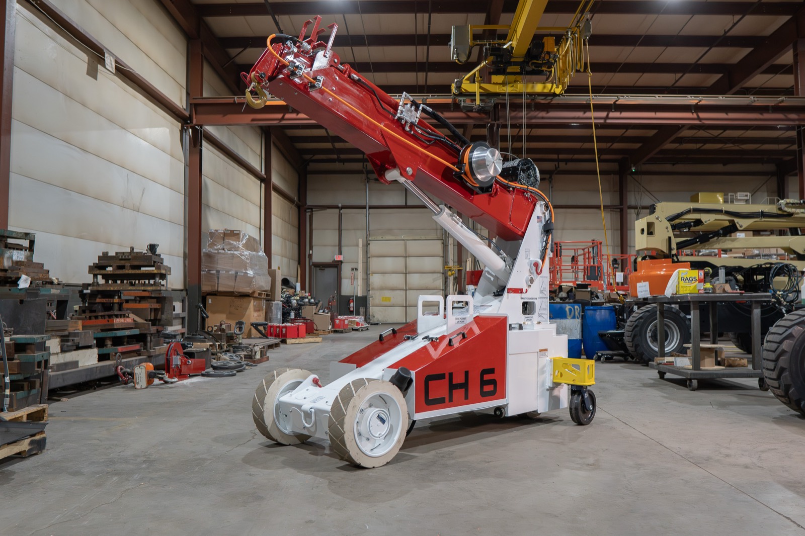 Bailey CH 6 compact pick-and-carry crane with its boom raised on the shop floor