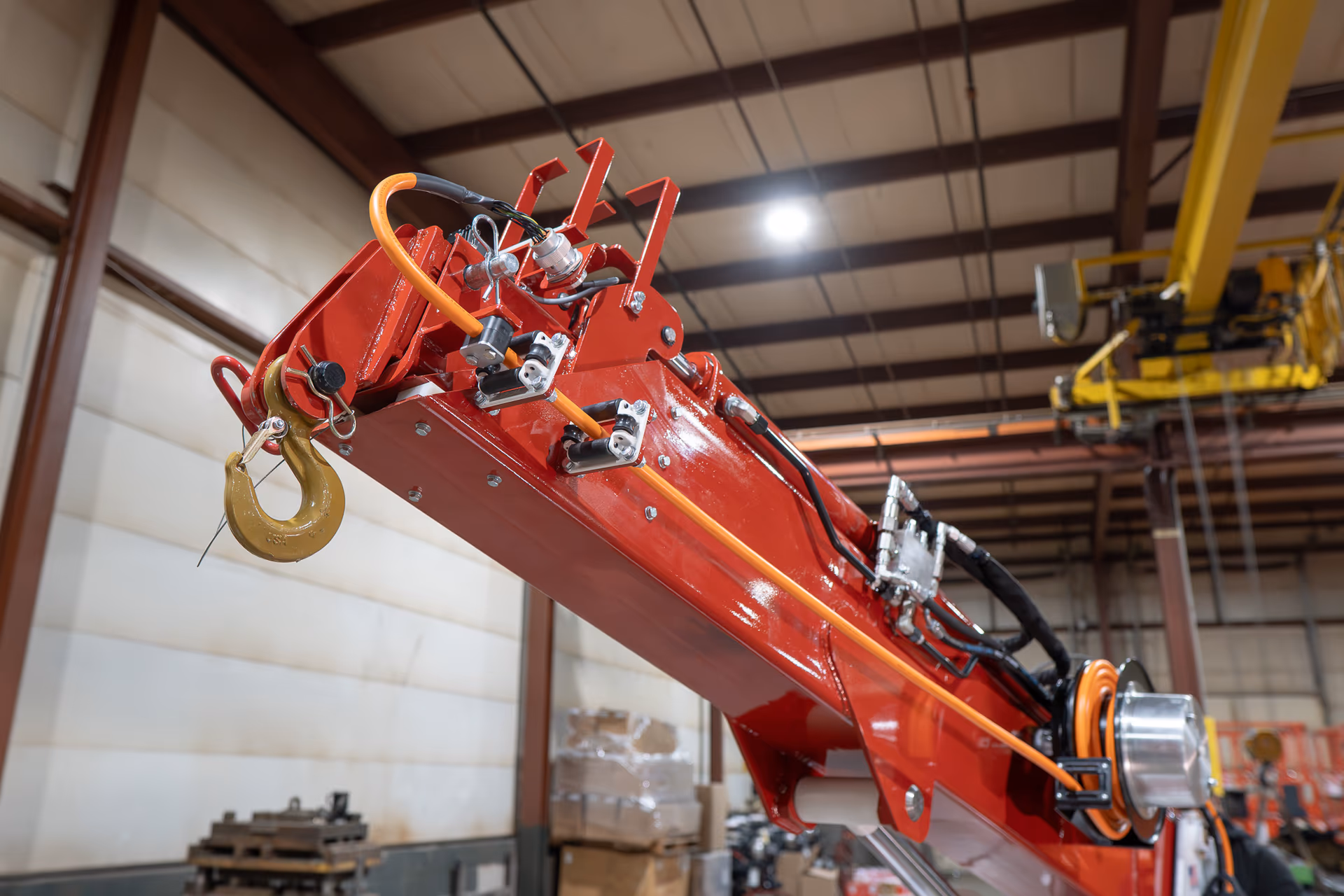 Close-up of the Bailey CH 6 boom head, lifting hook, and hydraulic hoses