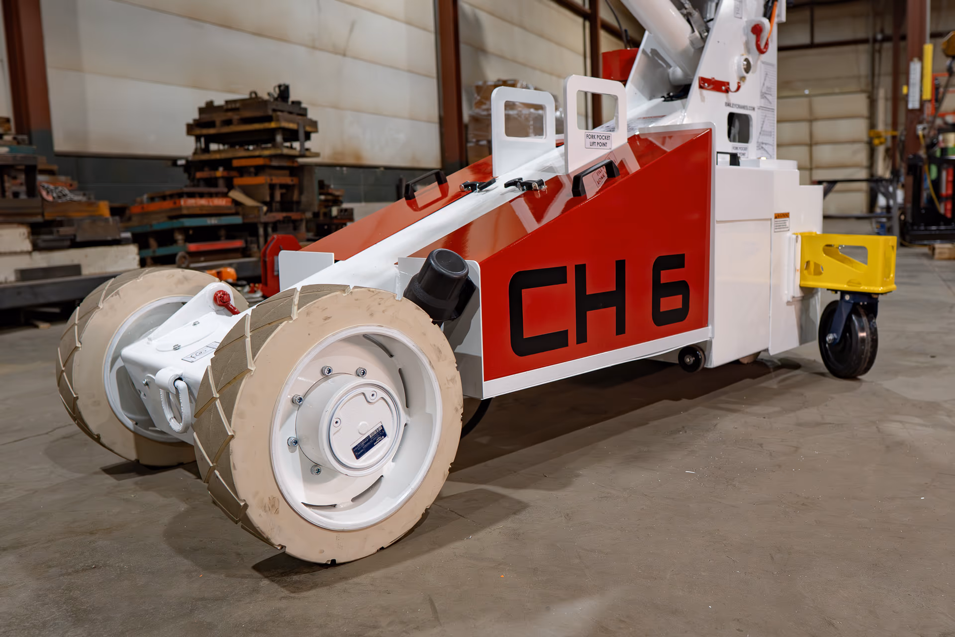 Side view of the Bailey CH 6 Compact Handler showing its compact chassis and non-marking drive wheels